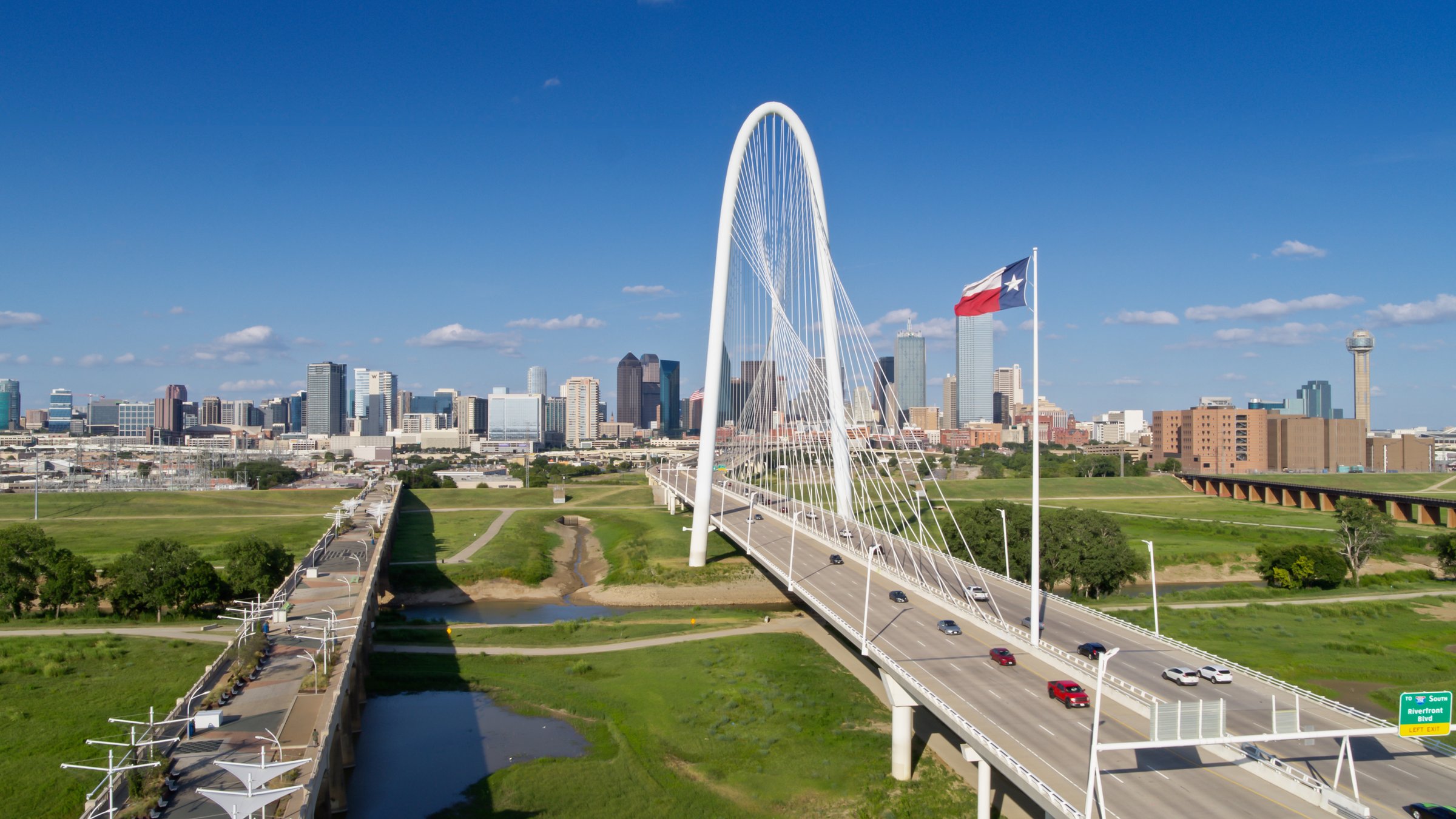 Dallas, Texas skyline behind the Margaret Hunt Hill Bridge
